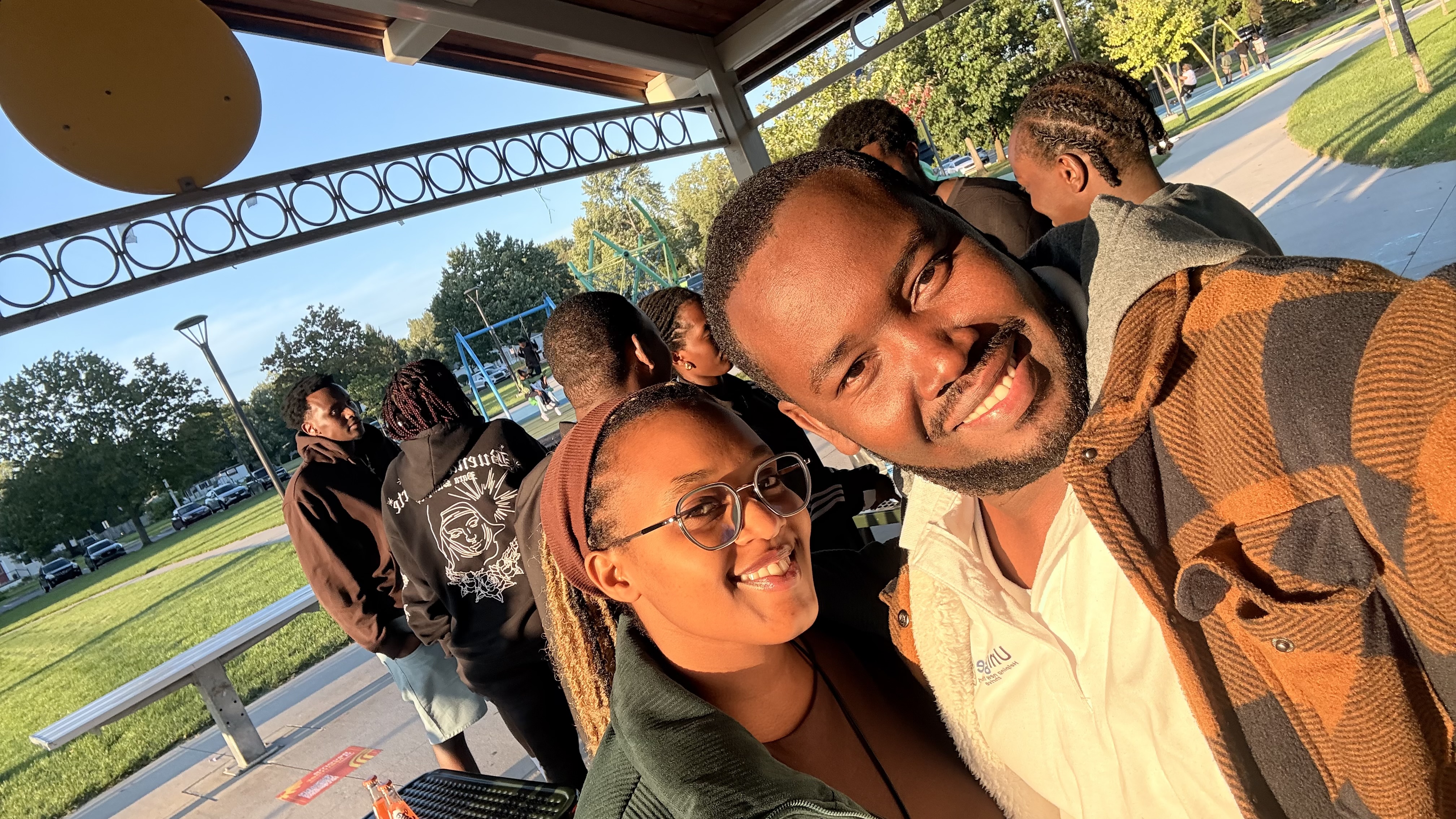 Two community members share a selfie at the Iwacu Rwanda Family Day gathering.